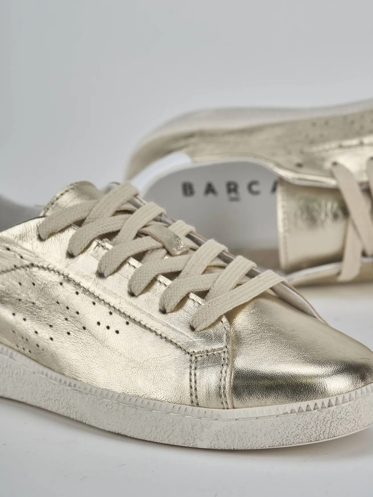 Sneakers laminato oro