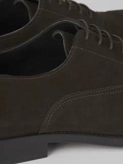 Stringate camoscio testa