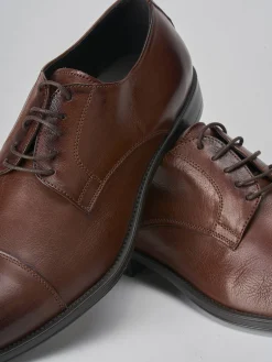 Stringate pelle testa