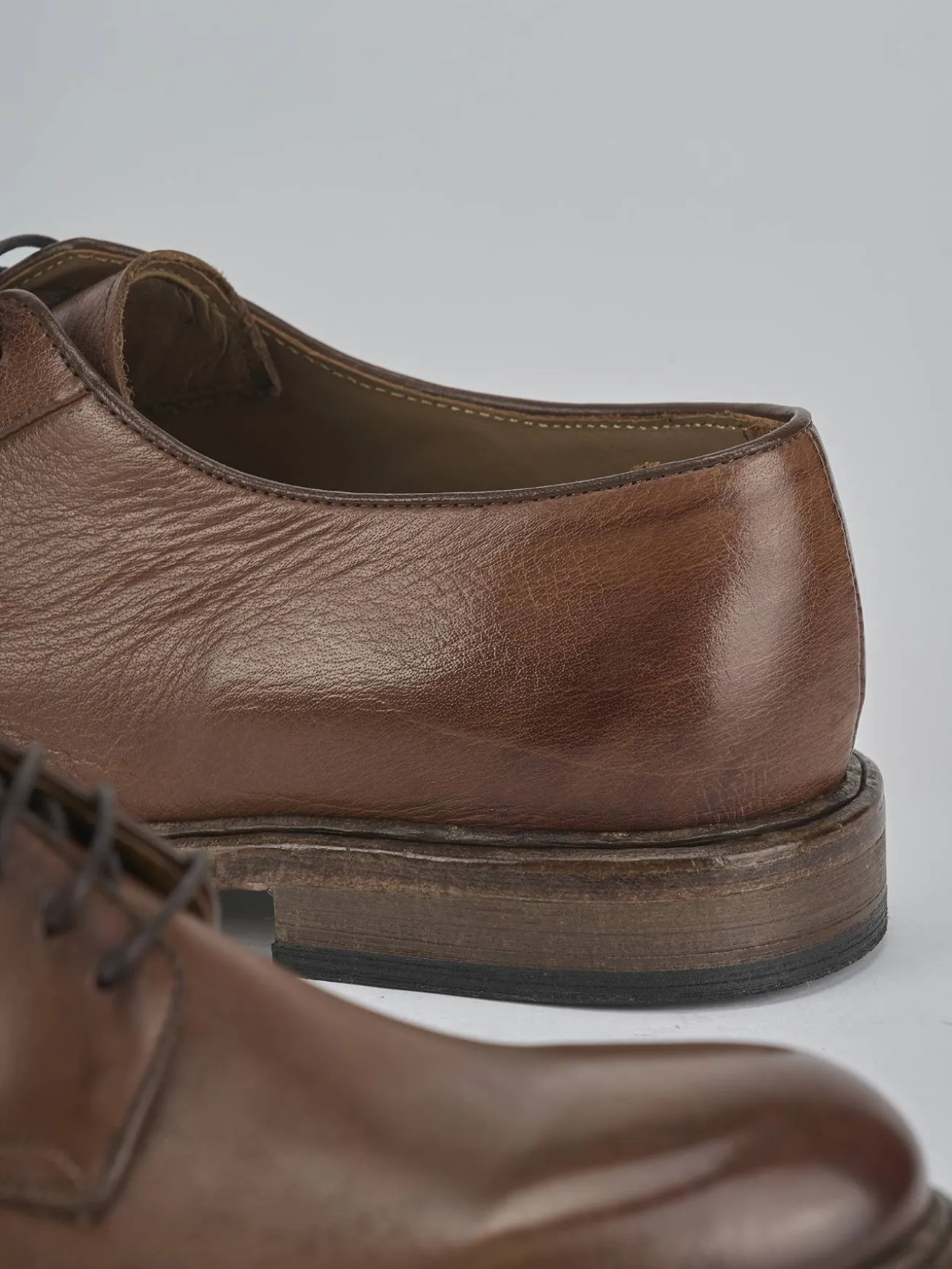 Stringate pelle testa